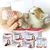 Kitten being bottle-fed with Lactol milk replacer, surrounded by various Lactol puppy and kitten milk products and feeding accessories.