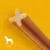 Friandise en forme de bâtonnet à section étoilée, pictogramme chien et texte « 25 kg+ » indiquant la taille recommandée pour chiens de plus de 25 kg.