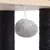 Grey plush ball on a string, attached under a wooden board between two black sisal posts.