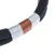 Close-up of a black rope with silver and copper-coloured band, suitable for pet accessories or toys.