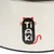 Tiaki logo with cat ears, whiskers and red cat tail on white background.