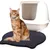 Cat litter mat with black honeycomb structure in front of a white cat toilet.