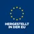 Hergestellt in der EU. Text mit gelben Sternen im Kreis auf blauem Hintergrund.