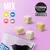 Cosma Pure Love Snackies, MIX, XXL Flavour Mix tub, four freeze-dried cubes, icons for chicken, tuna, salmon, and another fish visible on purple background.