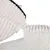 Gros plan sur une housse en tissu côtelé beige avec fermeture éclair blanche, doublure intérieure blanche et surface en tissu imitation laine.
