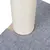 Scratching post made of light sisal with grey felt base.