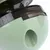 Green plastic toy with black twist cap and opening for treats.