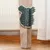Brush shaped like a bear's head, attached to a wooden post. Suitable for pets' self-grooming by rubbing.