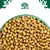 Close-up of dry pet food kibble in a green bowl, with a tree and animal symbol above. Shows product shape and quantity for shopping decisions.