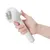 Hand holding a white brush with metal bristles, suitable for coat care.