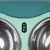 Tiaki double bowl made of stainless steel with mint green and turquoise plastic frame.