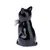 Figurine en céramique noire représentant un chat vu de dos, tenant un petit objet blanc dans la patte gauche. Aucun texte ou marque visible.