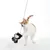 Toy on string with Batman design, played with by cat. Shows product in use.