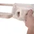 Hand showing removable, soft cover made of cream-coloured fabric on a wooden platform.