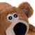 Giocattolo di peluche a forma di orso con pelliccia marrone, occhi ricamati e naso nero.