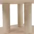 Scratching post columns wrapped with sisal, mounted on wooden platform.