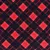 Motif écossais à carreaux rouges et noirs sur tissu, gros plan du matériau visible.