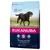 Saco de pienso Eukanuba Thriving Mature para perros, con imagen de perro negro corriendo. Texto visible: 'Optimal Body Condition', '+6 años razas grandes 25–40 kg, +8 años razas gigantes >40 kg'.