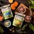 Forthglade natural soft bites pet food packs, salmon with herring and chicken with duck flavours, shown with heart-shaped treats and fresh ingredients including meat and vegetables.