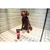 Dog sitting in a tiled shower next to a tube labelled 'animology Puppy Love', demonstrating use of the grooming product.