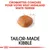 Texte : Croquettes conçues pour votre West Highland White Terrier. TAILOR-MADE KIBBLE. Image d'une croquette individuelle au centre.