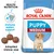 Royal Canin PUPPY MEDIUM -koiranruokapakkaus, näkyvissä nappuloiden koko, tekstit: Health Nutrition, Immune system support, Adapted kibble size.