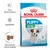 Royal Canin Puppy Mini 2–10 months kutyatáp csomagolás, erős immunrendszer, agyfejlődés, táp szemcseméret adaptált feliratokkal és három tápdarab képe. Royal Canin Puppy Mini 2–10 months kutyatáp csomagolás, erős immunrendszer, agyfejlődés, táp szemcseméret adaptált feliratokkal és három tápdarab képe.
