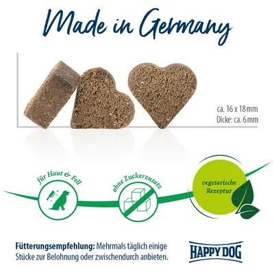 Made in Germany, ca. 16 x 18 mm, épaisseur env. 6 mm, sans sucre ajouté, recette végétarienne, Happy Dog. Texte allemand visible : für Haut & Fell, Fütterungsempfehlung.