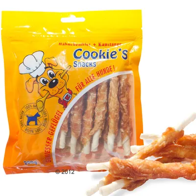 Bolsa de 200 g de Cookie's Snacks, palitos masticables con pollo. Texto visible: 'Für alle Hunde!', '100% Natur', imagen de perro con gorro de chef.