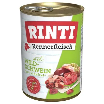 Blik Rinti Kennerfleisch met wild zwijn, graanvrij. Afbeelding van vleesstukken en orgaanvlees op de verpakking. Tekst: 'Seit 1986 Original'.