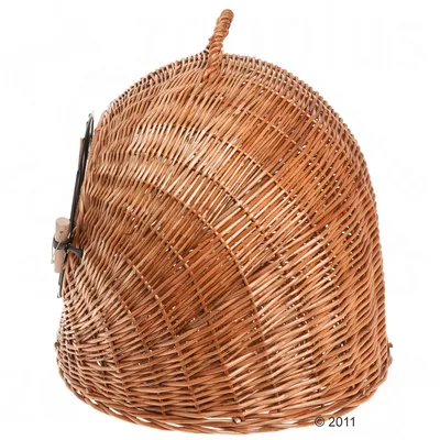 Wicker pet carrier with a rounded dome shape, front metal latch and handle on top, shown closed.