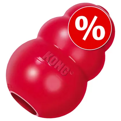 Juguete de goma roja KONG con símbolo de porcentaje en círculo rojo, indicando oferta o descuento visible en la imagen.