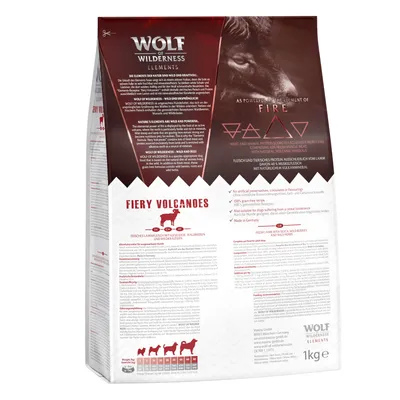 Wolf of Wilderness Elements Fiery Volcanoes, alimento per cani, 1 kg. Testo visibile in inglese e tedesco, icone di ingredienti, tabella peso cane, simboli elemento fuoco.