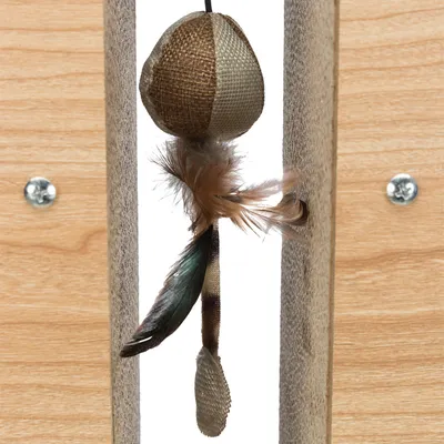 Toy made of fabric and feathers, attached to a scratching post with wood and sisal elements.