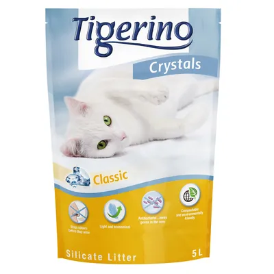 Tigerino Crystals Classic Silicate Litter 5L, antibacterieel, composteerbaar, stopt geurtjes, licht en zuinig. Witte kat op de verpakking. Engelstalige pictogrammen zichtbaar.