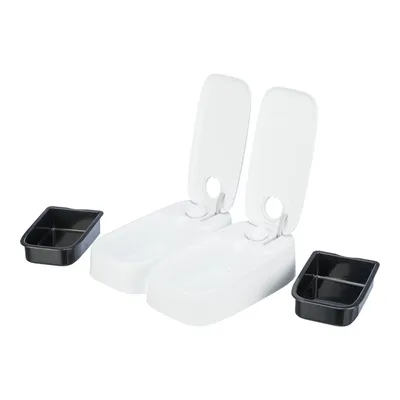 Two white automatic feeders with open lids and two black removable food trays, each with two compartments.