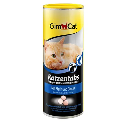 GimCat Katzentabs, Mit Fisch und Biotin. Tablettipurkki, jossa oranssi kissa ja kolme vaaleanpunaista tablettia etiketissä. Teksti useilla kielillä.