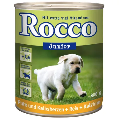 Lata de comida para cão Rocco Junior, 800 g. Texto visível: Mit extra viel Vitaminen, Extra viel Kalzium, Gesundes Wachstum, Omega 3+6 Fettsäuren, Pute und Kalbsherzen + Reis + Kalzium.