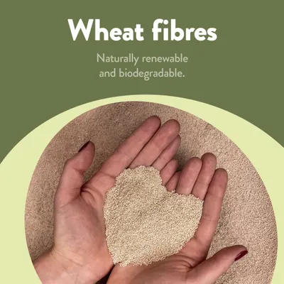 Wheat fibres, naturally renewable and biodegradable. Hands holding a portion of the fibres.