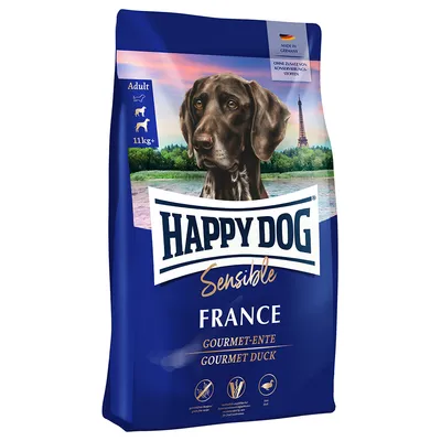 Happy Dog Sensible France Gourmet-Anatra. Prodotto in Germania, senza conservanti aggiunti. Adatto a cani da 11 kg. Adult. Confezione con immagine di cane e Torre Eiffel sullo sfondo.