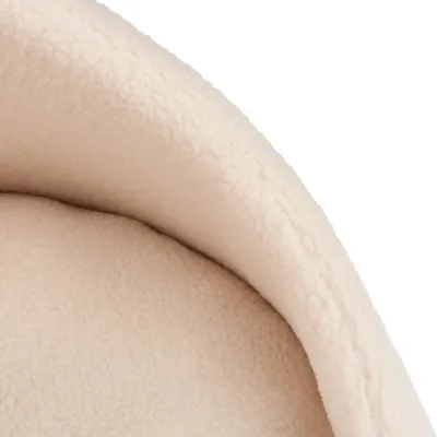 Nahaufnahme eines beigen, weichen Fleece-Materials, möglicherweise Teil eines Haustierbetts oder einer Decke.
