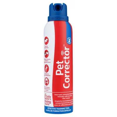 Spray Pet Corrector, envase rojo y blanco con tapón azul. Texto visible: 'Interrupts unwanted behaviour instantly with harmless hiss sound', 'Safe Nature's Hissing Sound'.