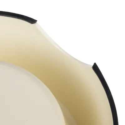 Close-up of a cream-coloured bowl with a non-slip black rim.