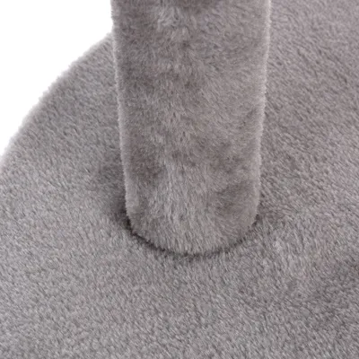 Primer plano de una funda de tela gris y suave sobre una base redonda y un poste vertical.