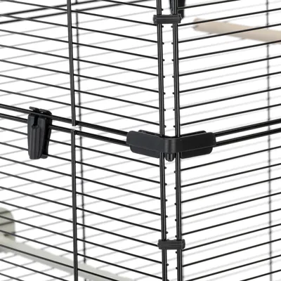 Close-up of a metal cage corner showing secure plastic connectors and clips for assembly and stability.
