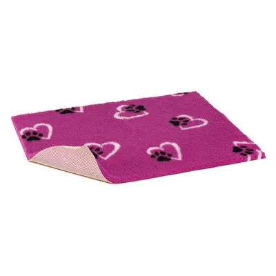 Pink pet blanket with heart and paw pattern, non-slip underside visible.