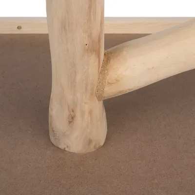 Close-up of a wooden leg with natural grain, connected to another wooden strut on a brown MDF board.