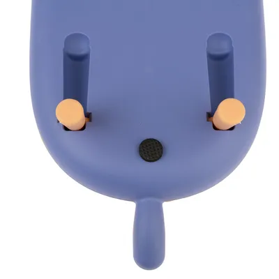 Blue plastic toy with two orange pegs and a black round surface. Suitable for interactive play.