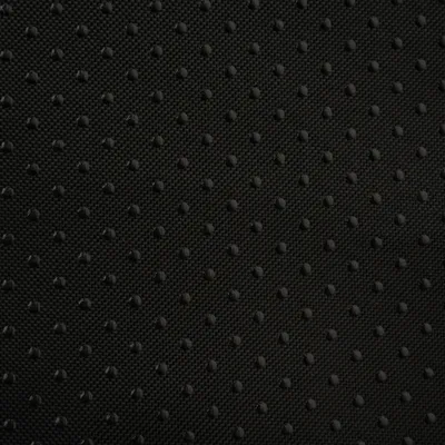 Materiale nero strutturato con piccoli punti per una superficie antiscivolo.