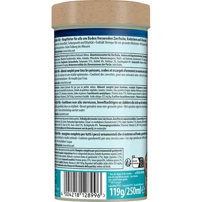 Étiquette d’un pot de 119 g/250 ml, texte en plusieurs langues. Français : aliment complet pour poissons, crabes et escargots d’ornement, contient des crevettes, ne trouble pas l’eau.